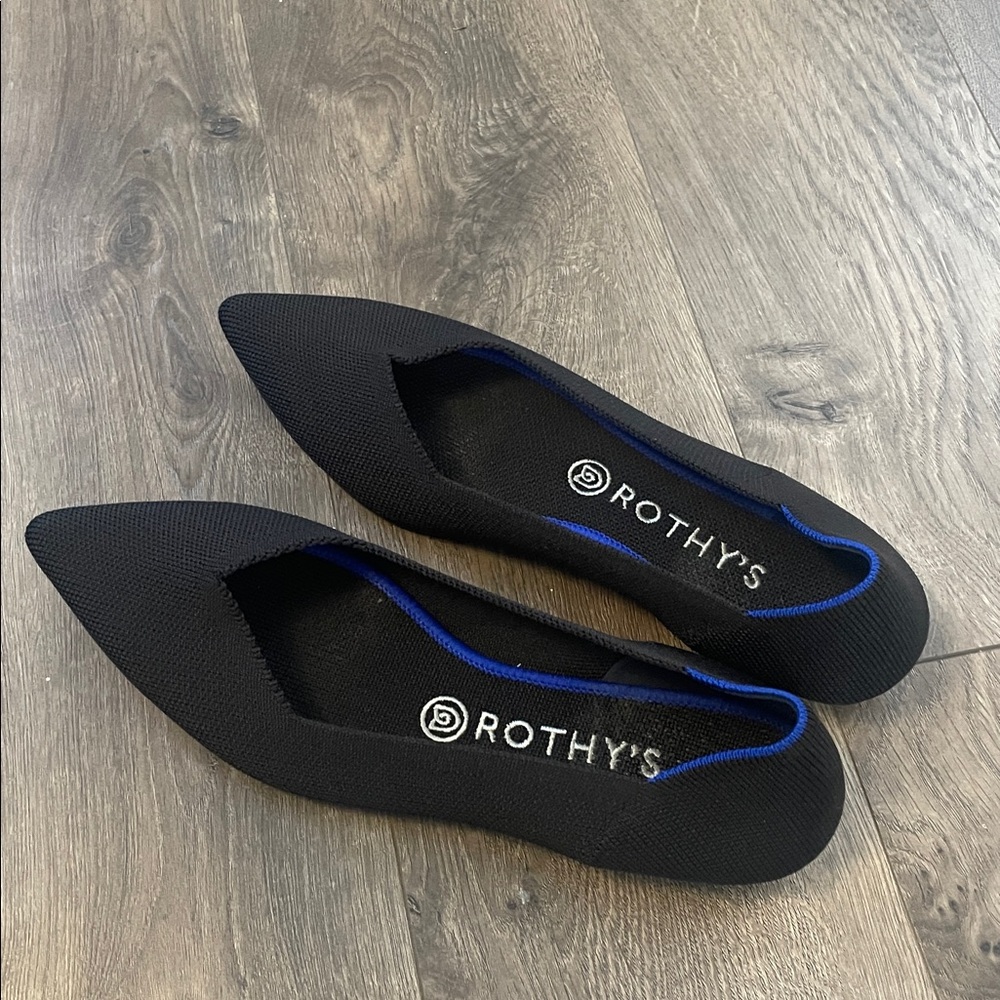 Rothy's Elegant Black Flats with Vibrant Blue Accent